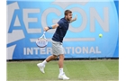 EASTBOURNE, ENGLAND - JUNE 16: Daniel Evans of Great Britain plays a backhand against Tobias Kamke of Germany during their Men's Singles first round match on day three of the Aegon International at Devonshire Park on June 16, 2014 in Eastbourne, England.  (Photo by Steve Bardens/Getty Images)